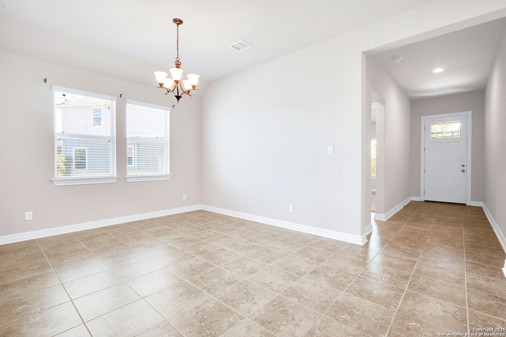11923 Hollering Pass Schertz, TX 78154 - Photo 6 of 43 a view of an empty room with a window