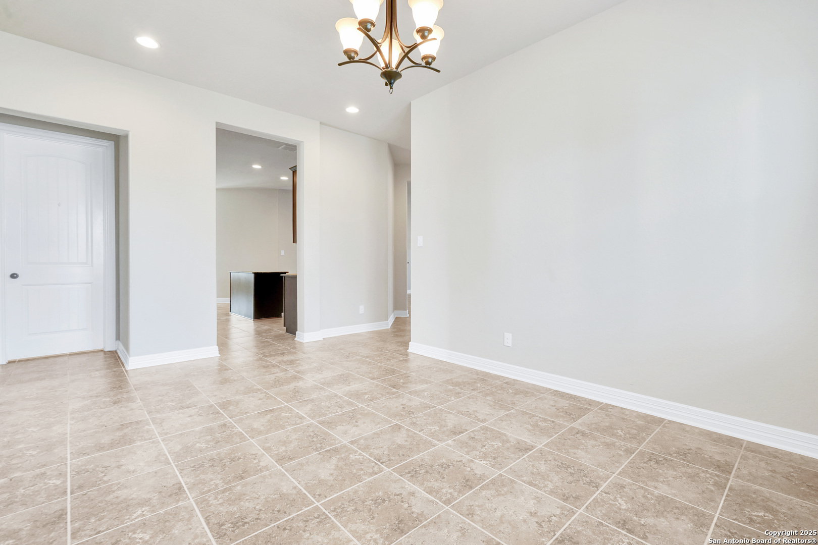 11923 Hollering Pass Schertz, TX 78154 - Photo 8 of 43 a view of an empty room with a ceiling fan