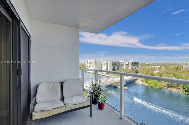 a view of a balcony with furniture