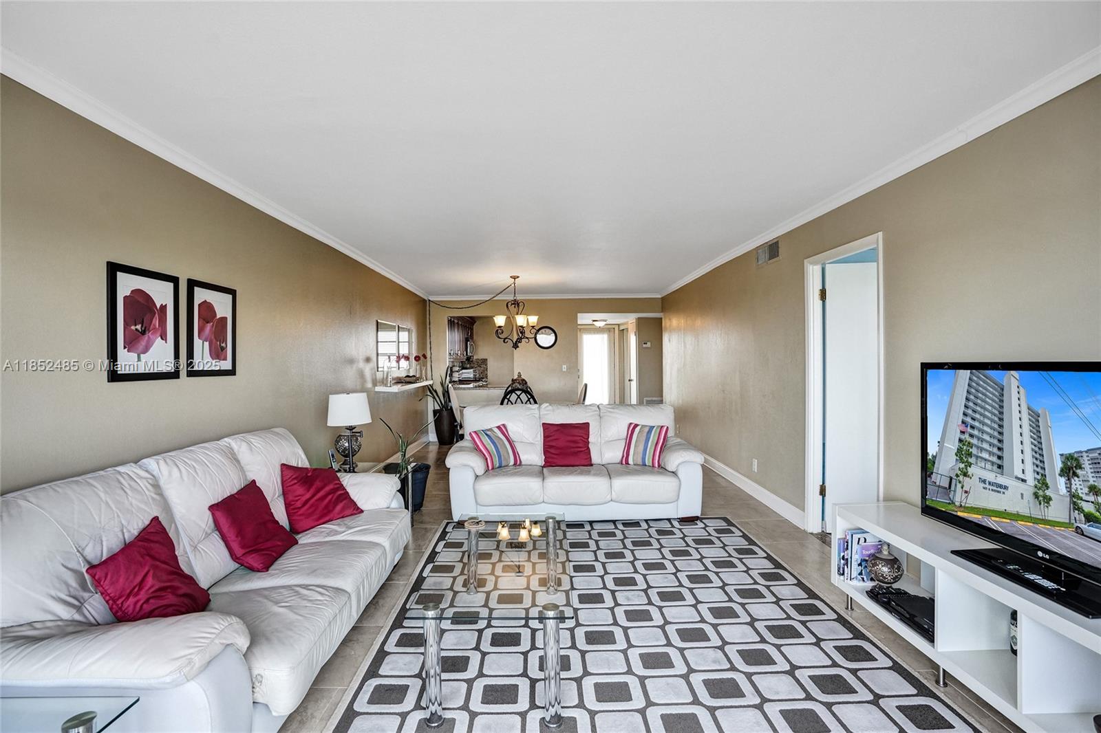 1401 North Riverside Drive, Unit 1005 Pompano Beach, FL 33062 - Photo 23 of 49 a living room with furniture and a rug