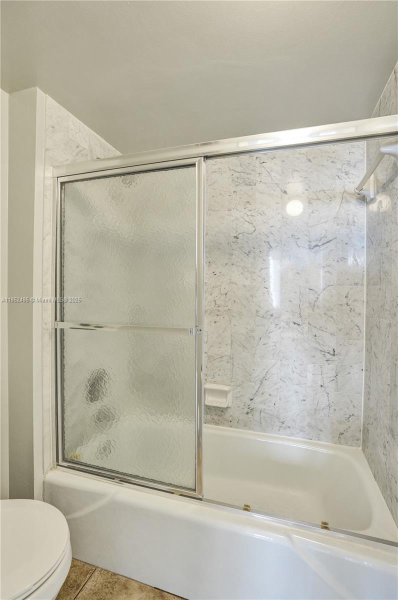 1401 North Riverside Drive, Unit 1005 Pompano Beach, FL 33062 - Photo 32 of 49 a bathroom with a shower and a toilet