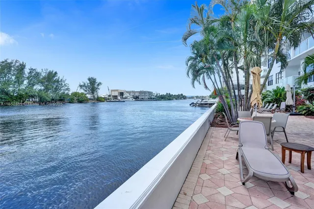 a view of swimming pool with outdoor space and seating area