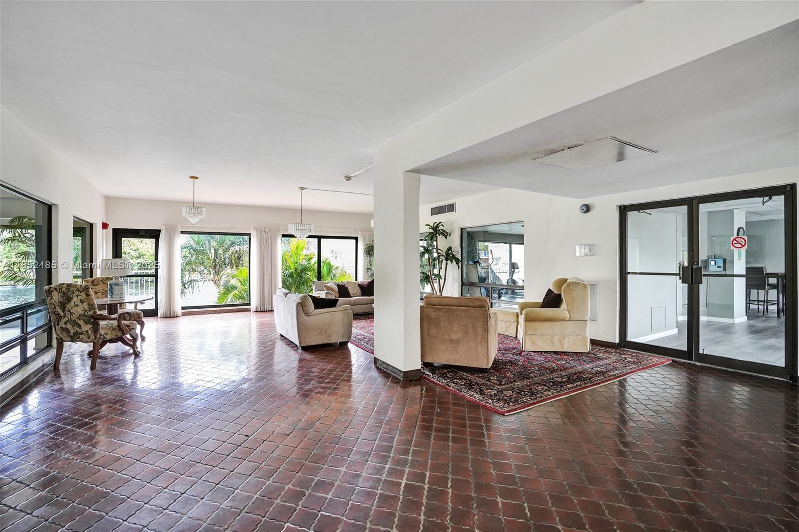1401 North Riverside Drive, Unit 1005 Pompano Beach, FL 33062 - Photo 46 of 49 a living room with furniture large window and wooden floor