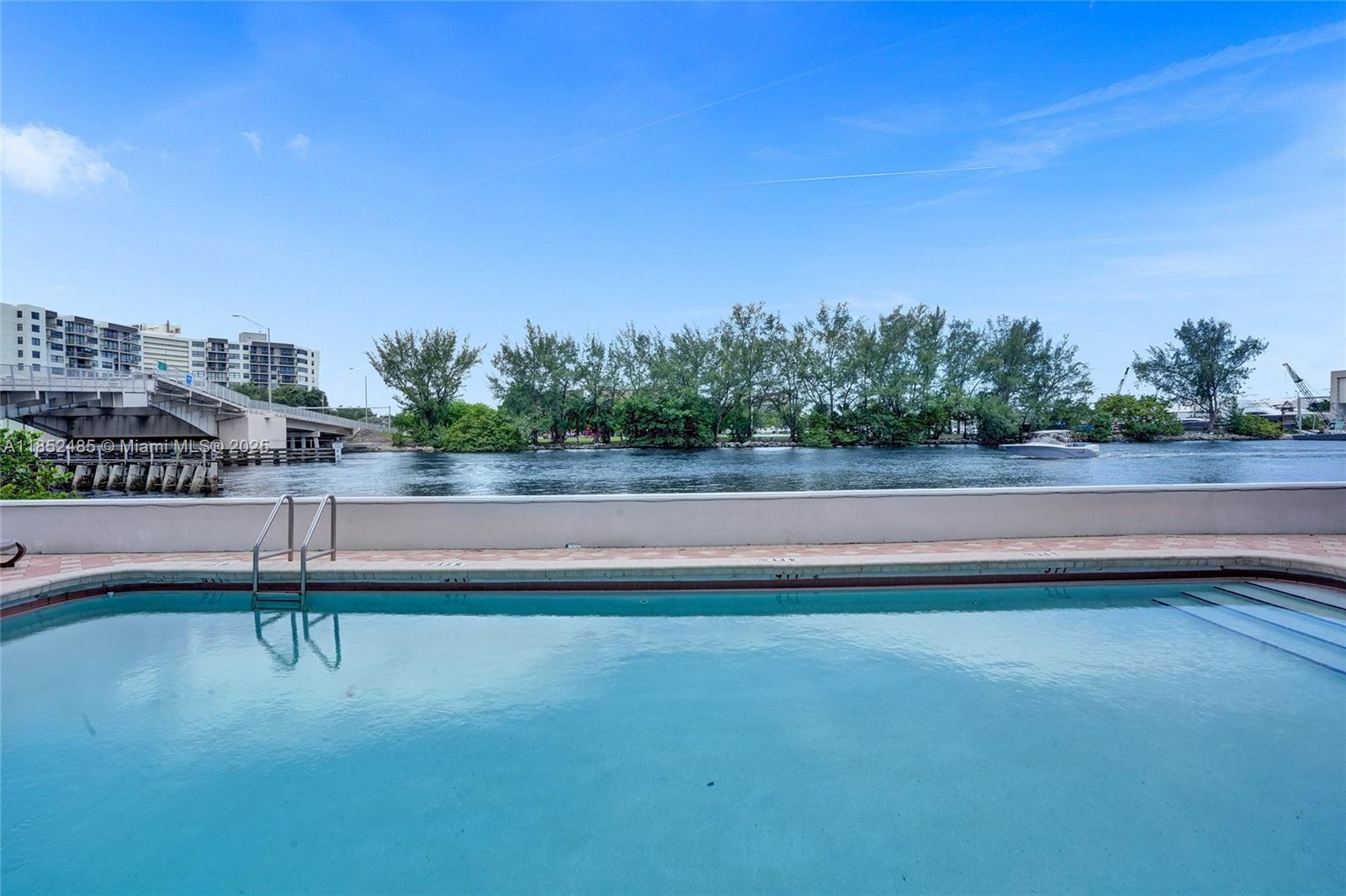 1401 North Riverside Drive, Unit 1005 Pompano Beach, FL 33062 - Photo 49 of 49 a view of swimming pool with outdoor space and seating area