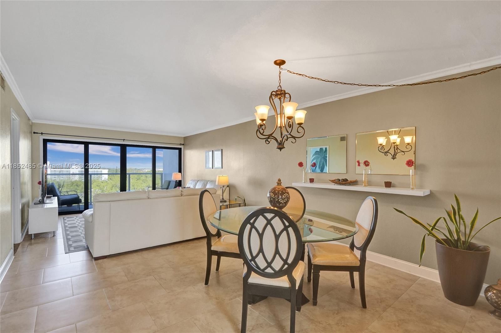1401 North Riverside Drive, Unit 1005 Pompano Beach, FL 33062 - Photo 5 of 49 a view of a dining room with furniture wooden floor and chandelier