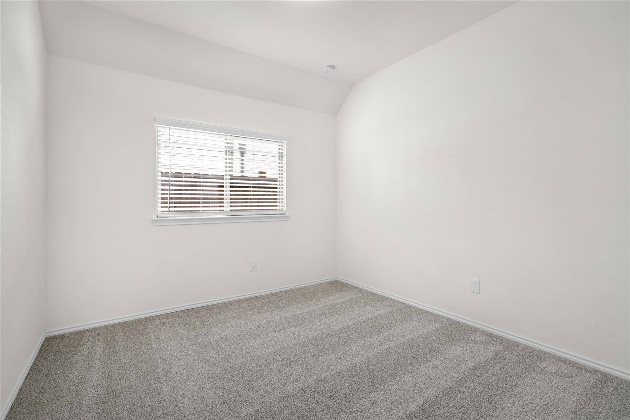 7480 Caprock Cyn Lane Porter, TX 77365 - Photo 11 of 13 an empty room with a window