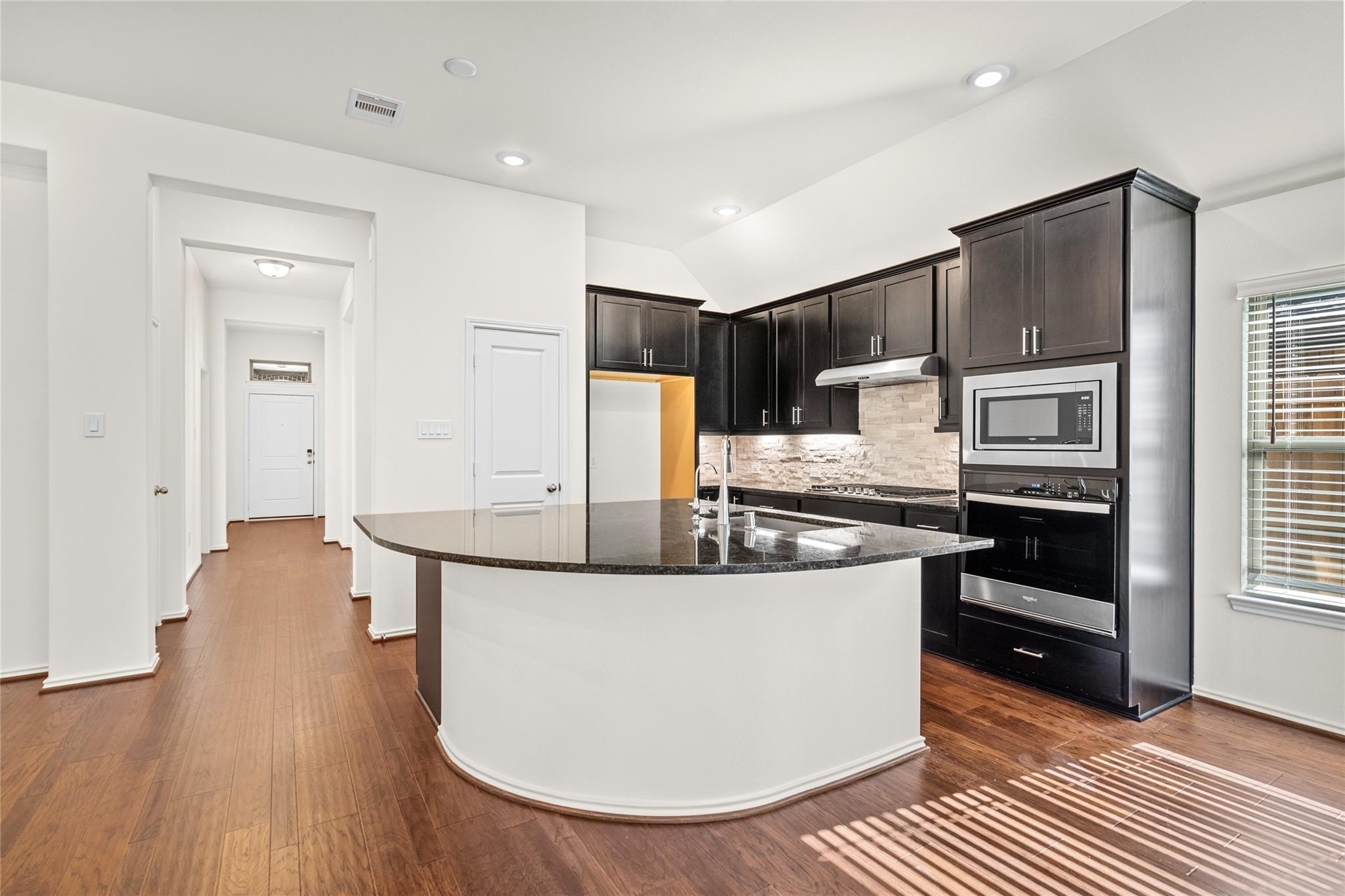 7480 Caprock Cyn Lane Porter, TX 77365 - Photo 7 of 13 a kitchen with stainless steel appliances granite countertop a sink stove and refrigerator