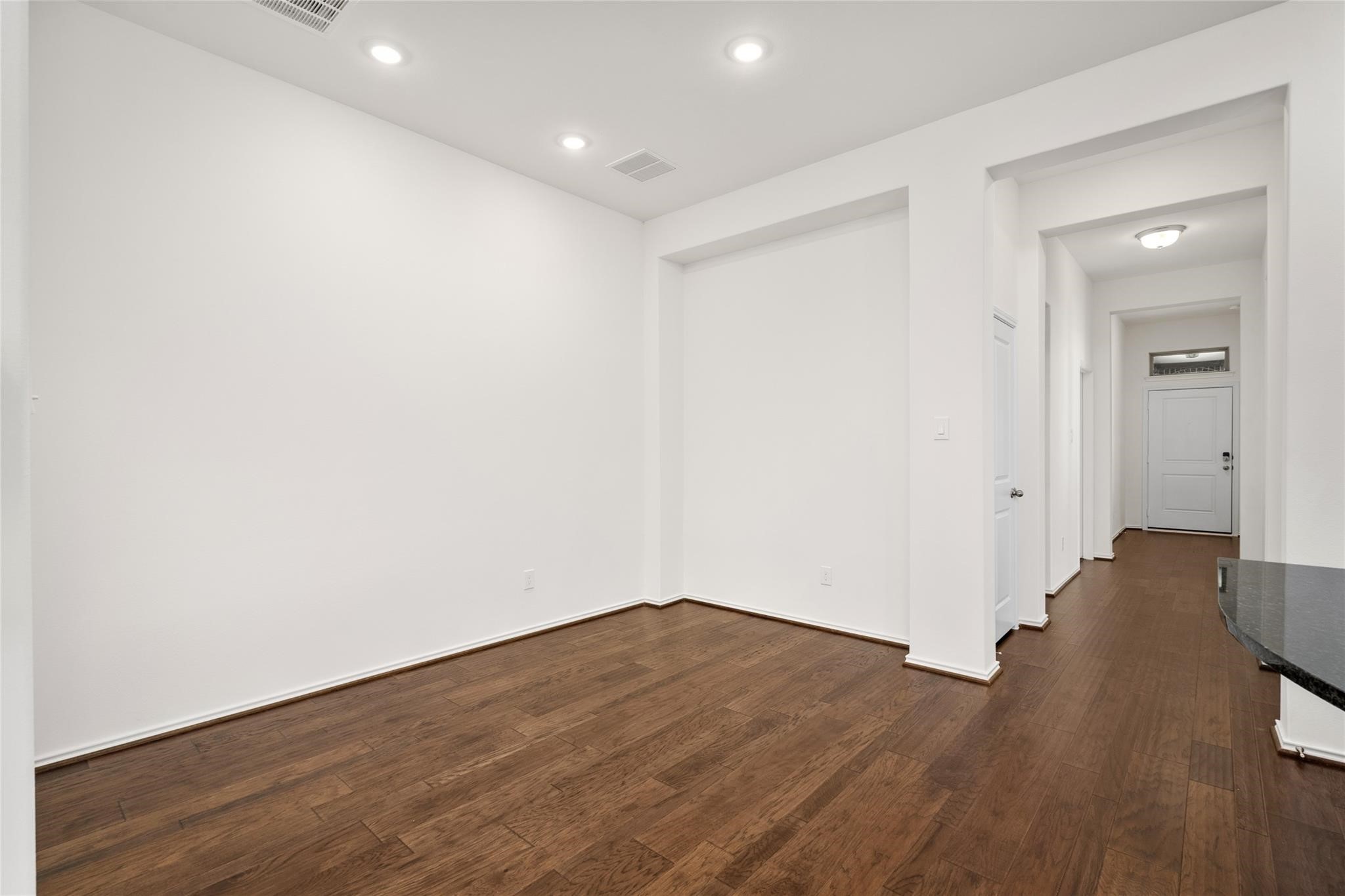 7480 Caprock Cyn Lane Porter, TX 77365 - Photo 10 of 13 a view of wooden floor and windows in a room
