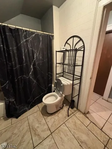 a kitchen with stainless steel appliances a stove a sink and a refrigerator