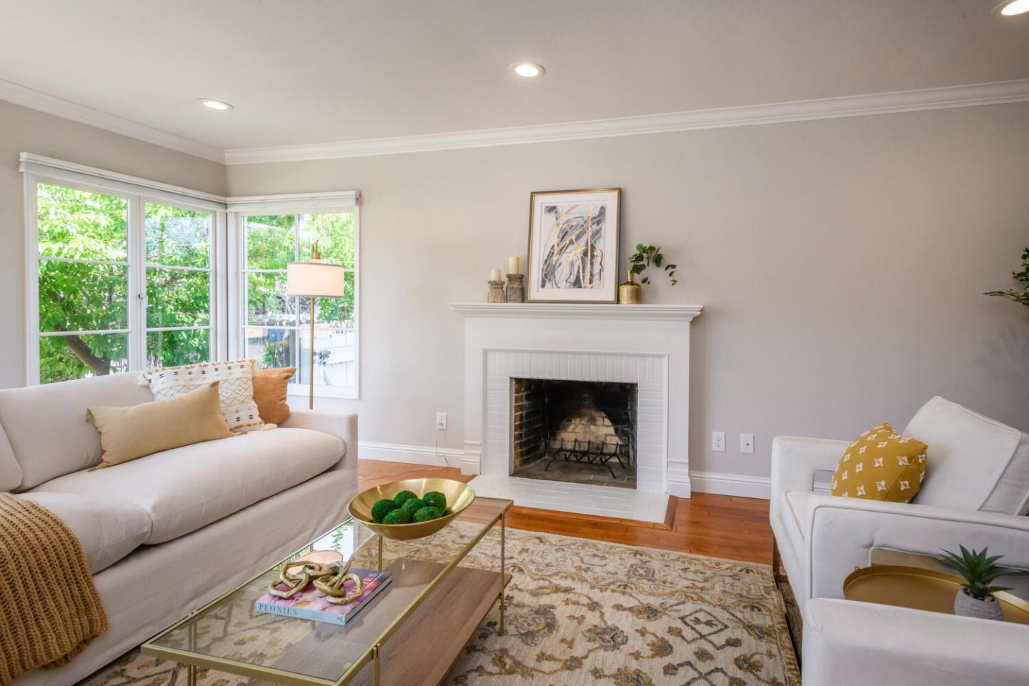 138 Channing Road Burlingame, CA 94010 - Photo 4 of 36 a living room with furniture and a fireplace