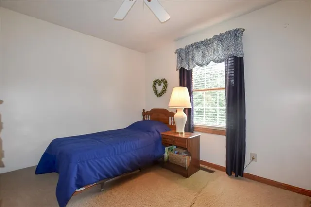 a bed room with a bed and a window