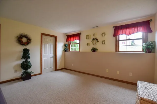 a view of a room with window and toys