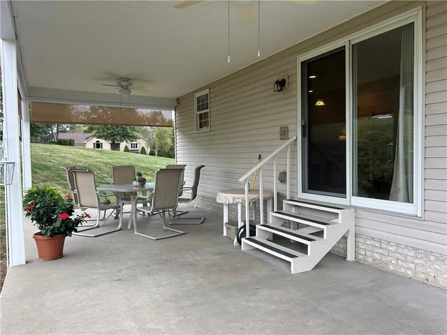 a view of two chairs in the balcony