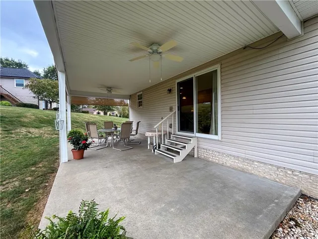 a view of a house with backyard porch and garden