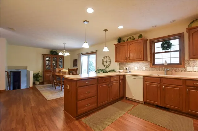 a large kitchen with lots of counter space and a sink