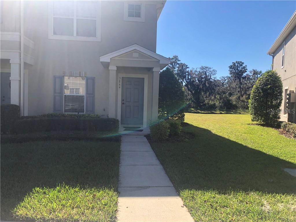 5844 Fishhawk Ridge Drive Lithia, FL 33547 - Photo 1 of 1 a view of a backyard with plants