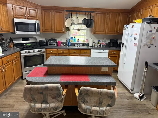 a kitchen with counter top space cabinets and stainless steel appliances
