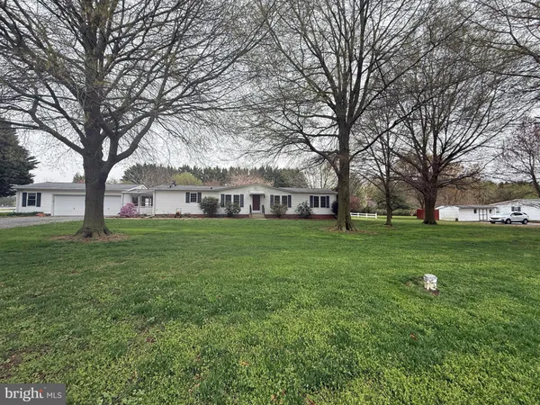 a view of a house with a big yard