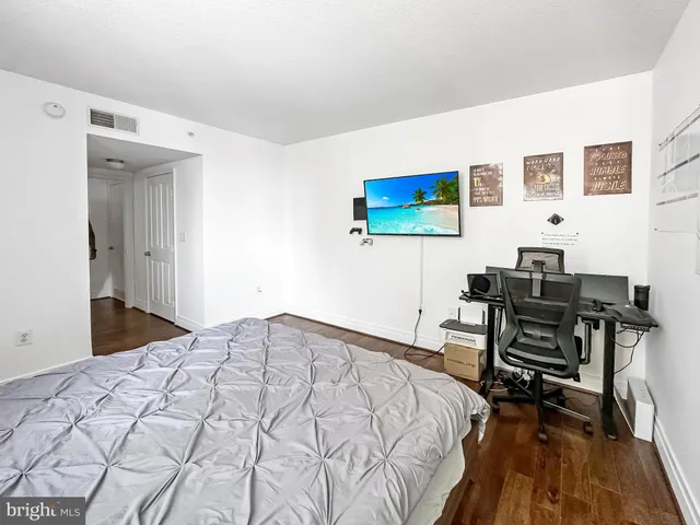 a bedroom with a bed and a table in it