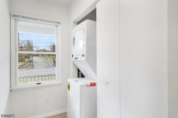 a view of storage and utility room with washer and dryer