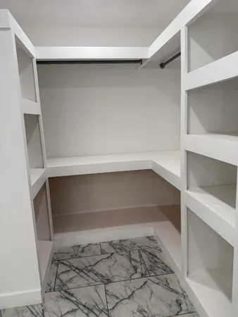 a view of an empty walk in closet