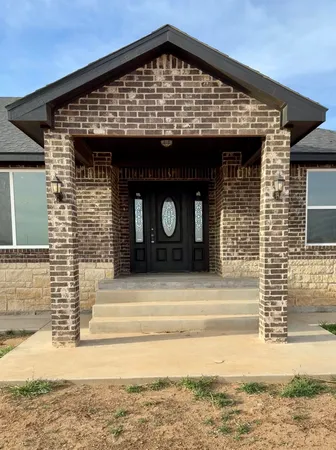 a front view of a house with parking