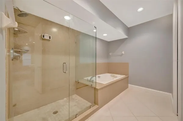a bathroom with a double vanity sink toilet and shower