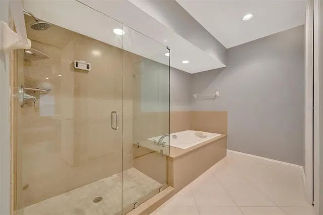 a bathroom with a double vanity sink toilet and shower