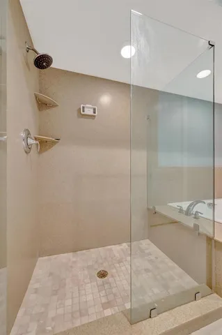 an empty room with windows and flat screen tv