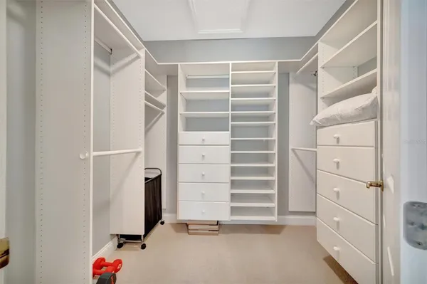 a spacious bathroom with a toilet sink and mirror