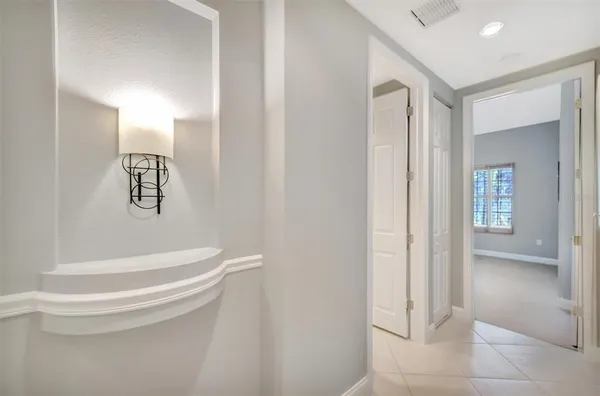 a spacious bathroom with a granite countertop sink mirror and