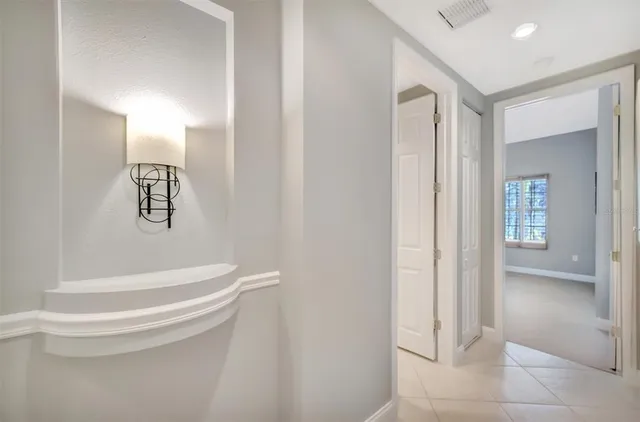 a spacious bathroom with a granite countertop sink mirror and