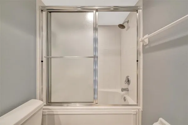 a view of a chairs and table under an umbrella