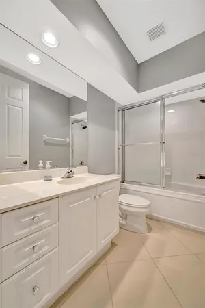 a view of a swimming pool with a garden and plants