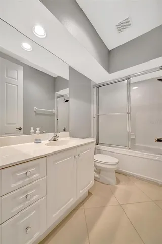 a view of a swimming pool with a garden and plants