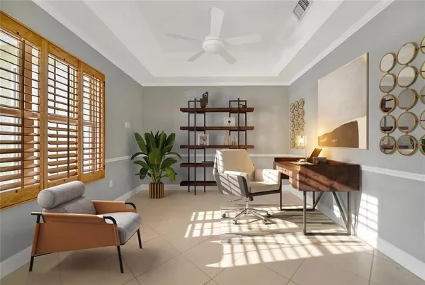 a front view of a building with river boats and palm trees