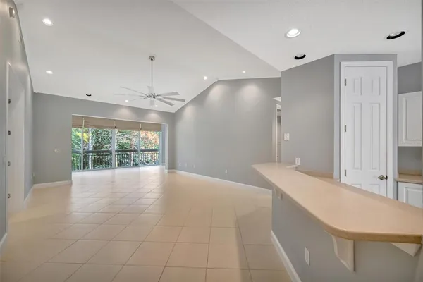 a view of an empty room with a large window