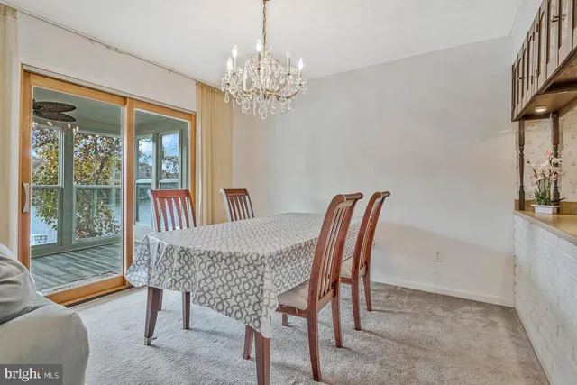 a kitchen with granite countertop a stove a sink and a microwave
