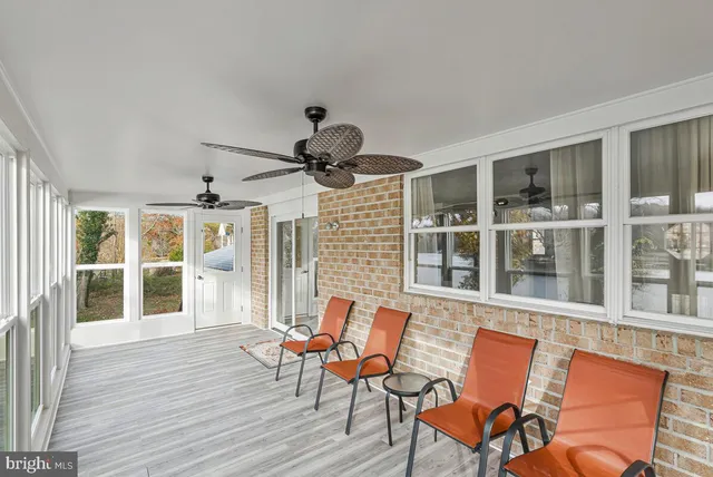 a open kitchen with a sink and refrigerator
