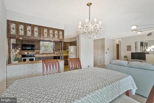 a kitchen with a stove a sink and a microwave