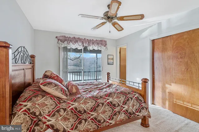 a bedroom with a bed and a closet