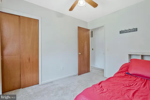 a view of a room with wooden floor and stairs