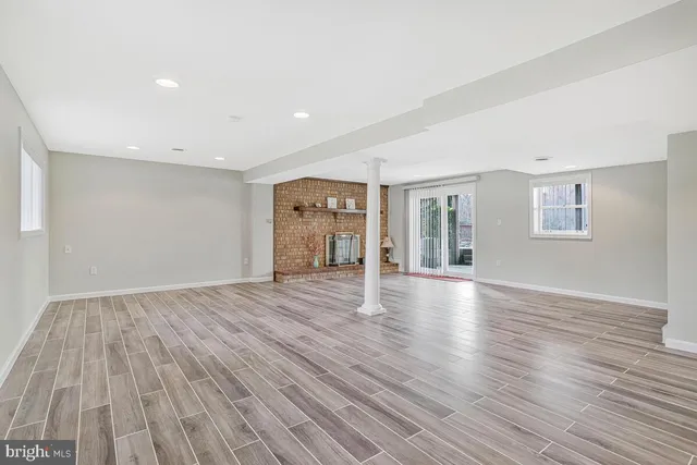 a view of a patio with table and chairs