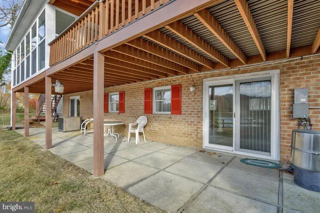 a view of a yard with wooden fence