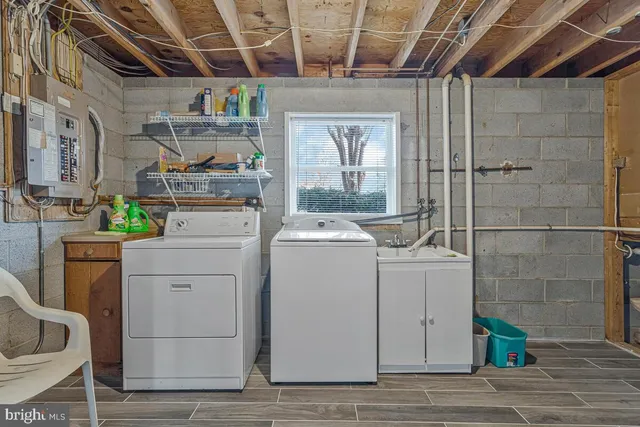 an aerial view of a houses with a lake view