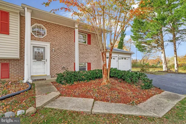 a view of a livingroom with furniture and hardwood floor