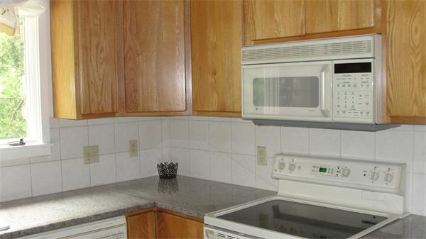 367 Conant Road Weston, MA 02493 - Photo 12 of 22 a kitchen with a sink cabinets and a window