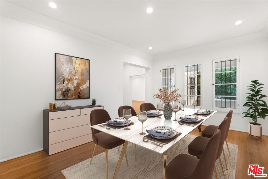 205 South Reeves Drive Beverly Hills, CA 90212 - Photo 2 of 13 a view of a dining room with furniture window and wooden floor