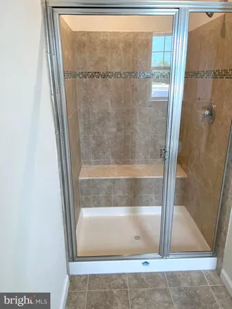 a view of a kitchen with wooden floor and electronic appliances