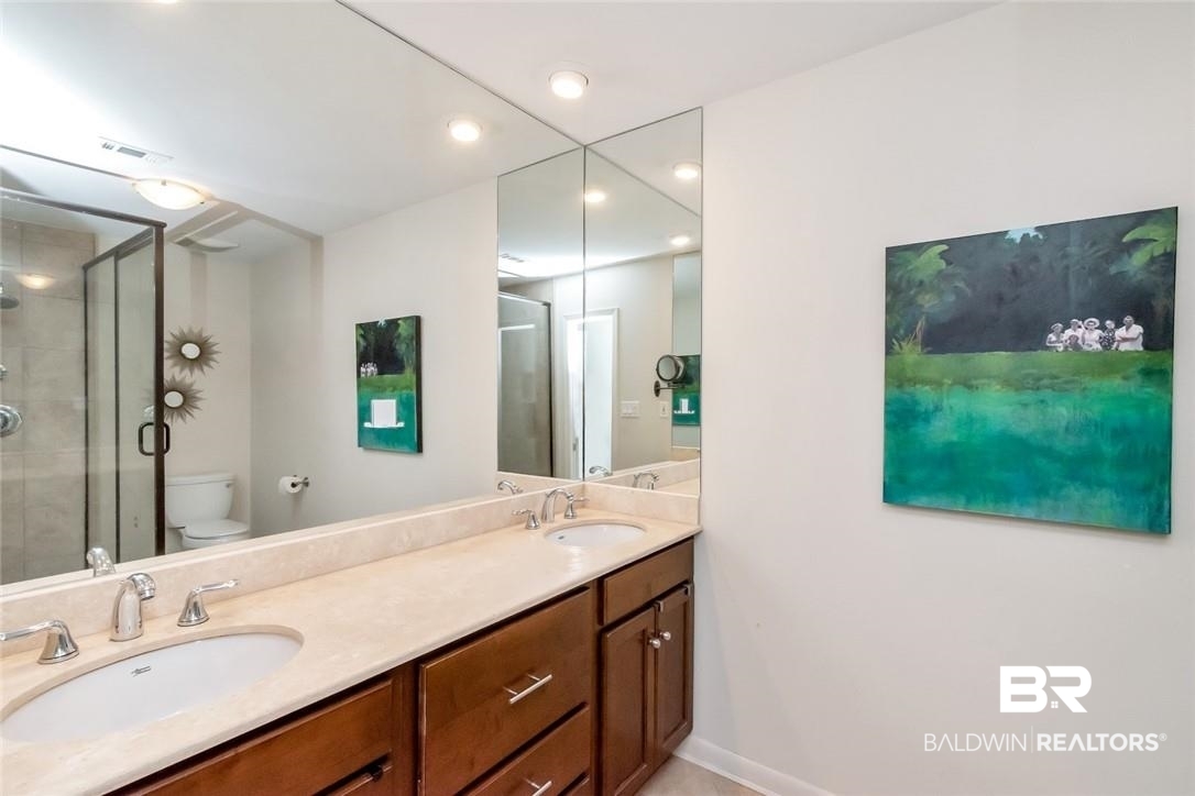 305 Fern Hill Court Mobile, AL 36608 - Photo 24 of 53 Bathroom featuring an enclosed shower, vanity, and toilet